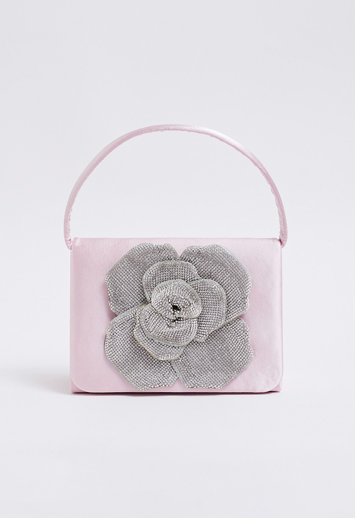 Bolso de mano de satén adornado con rosas radiantes en color rosa