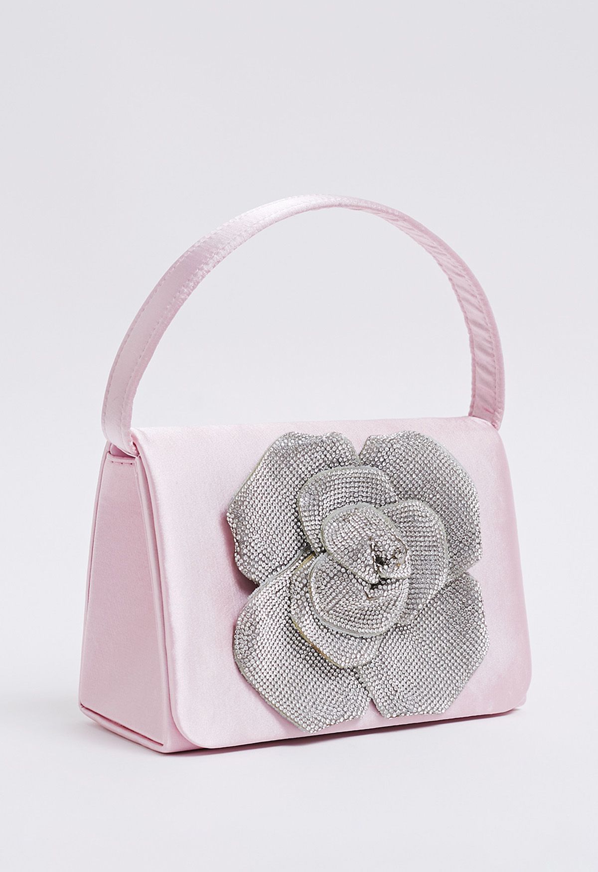 Bolso de mano de satén adornado con rosas radiantes en color rosa