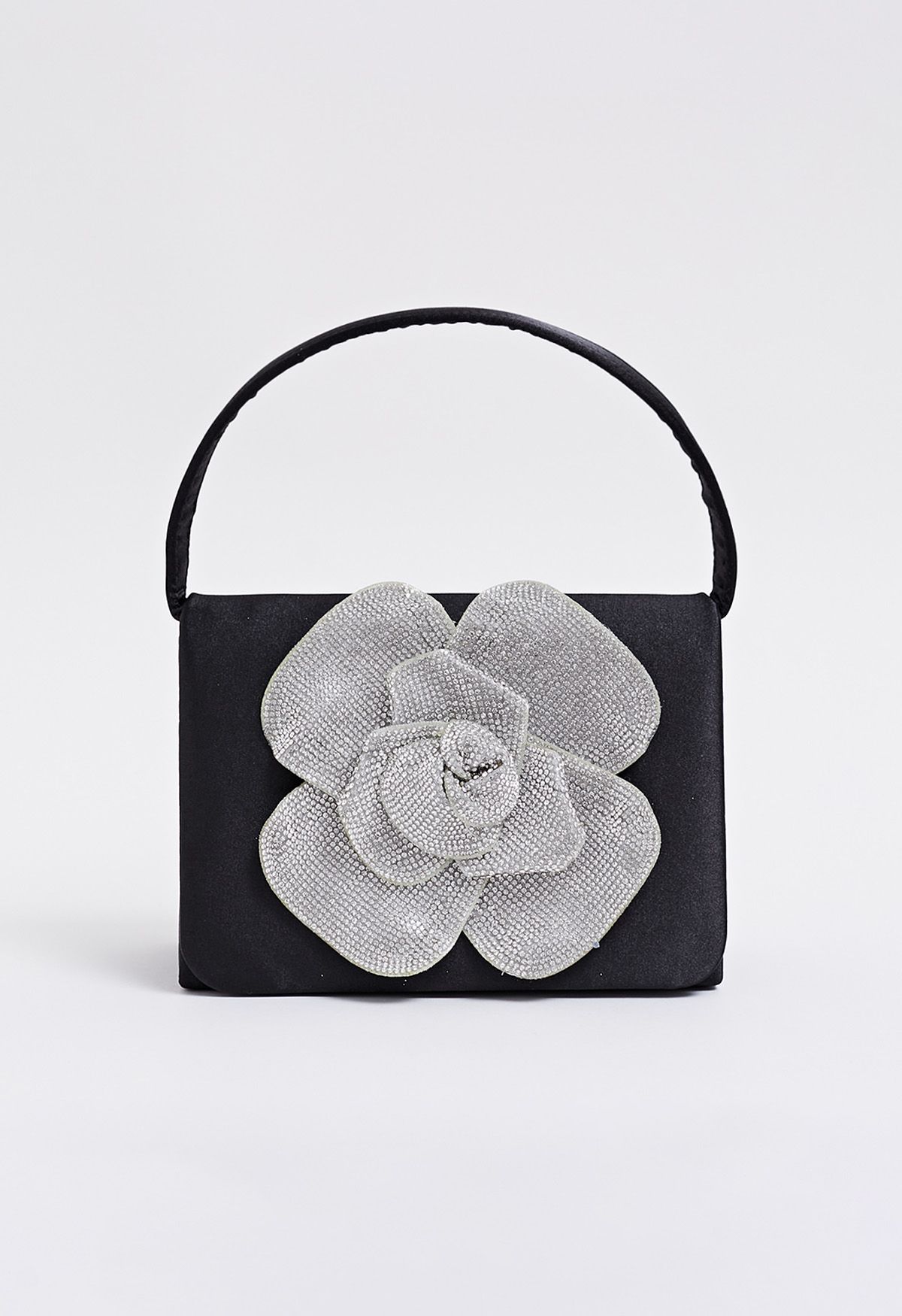 Bolso de mano de satén adornado con rosas radiantes en color negro