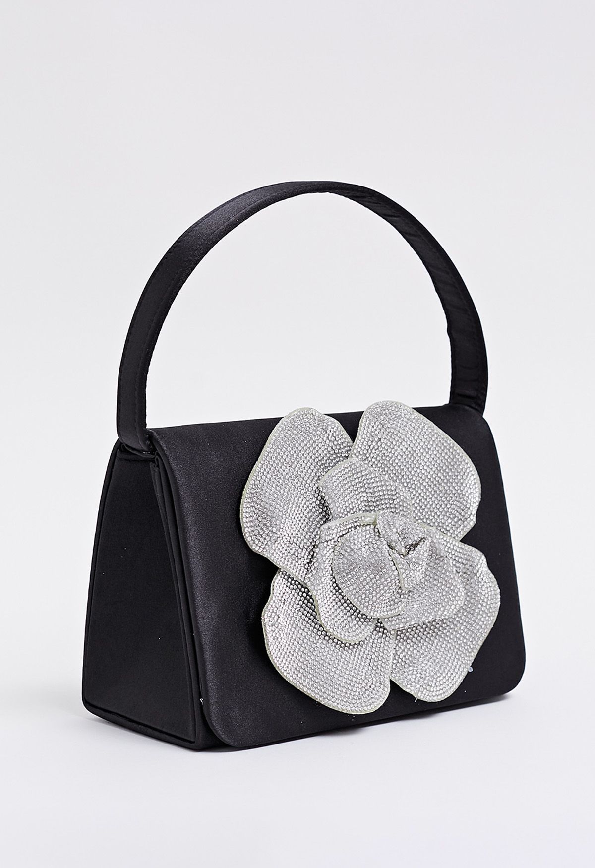 Bolso de mano de satén adornado con rosas radiantes en color negro