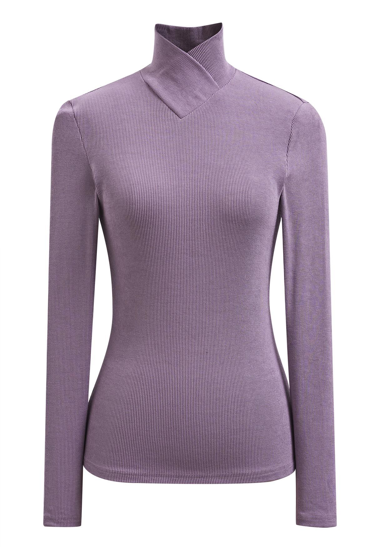 Blusa de manga larga con cuello alto y efecto cruzado en color lavanda