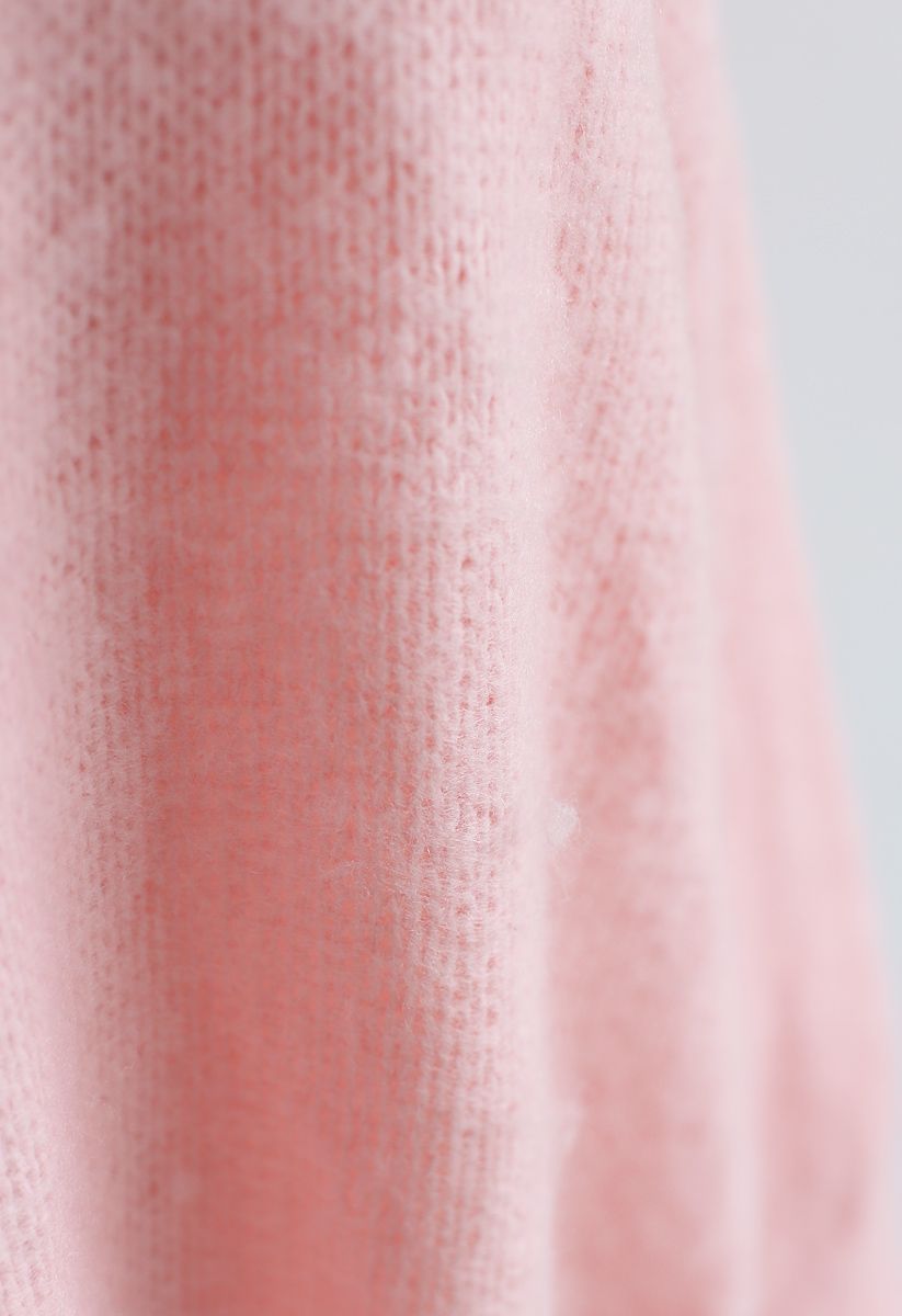 Suéter largo con hombros descubiertos y estampado Dreams en rosa
