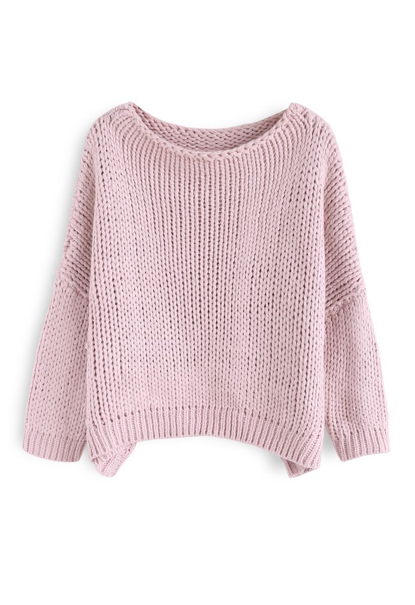 El otro lado del grueso suéter tejido a mano en rosa