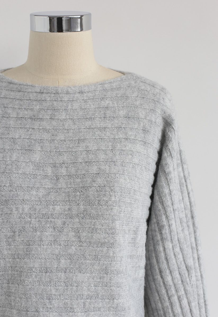 Suéter de punto acanalado con aberturas en gris