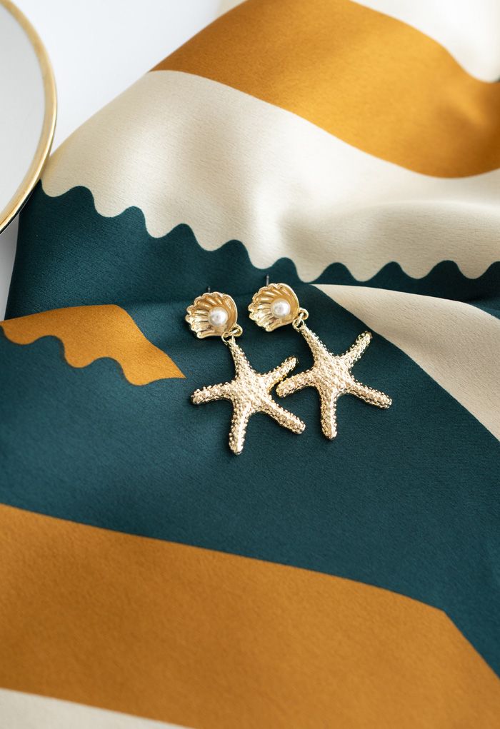 Aretes colgantes de perlas de concha de estrella de mar doradas