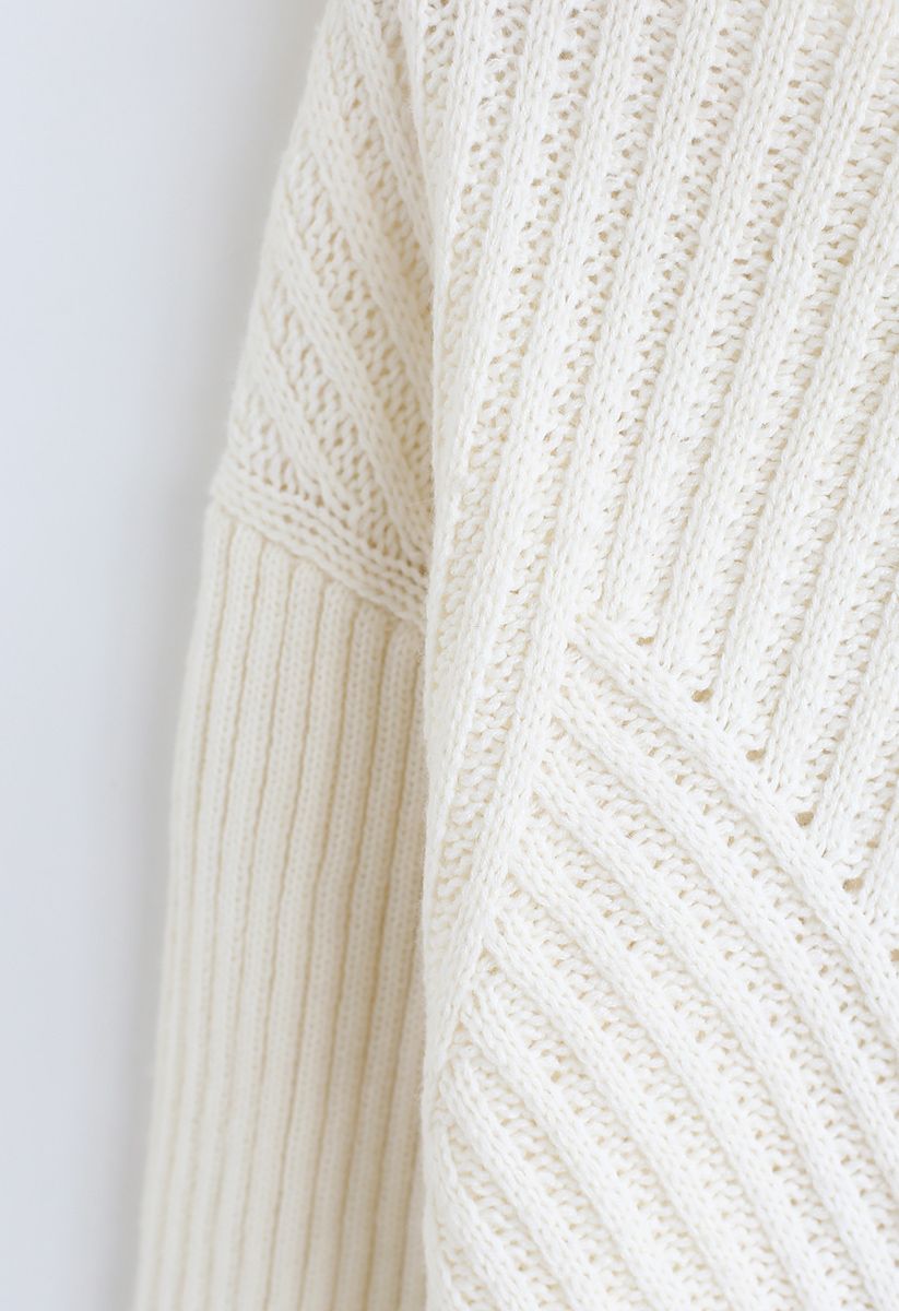 Suéter de punto acanalado con espalda recortada y lazo en marfil