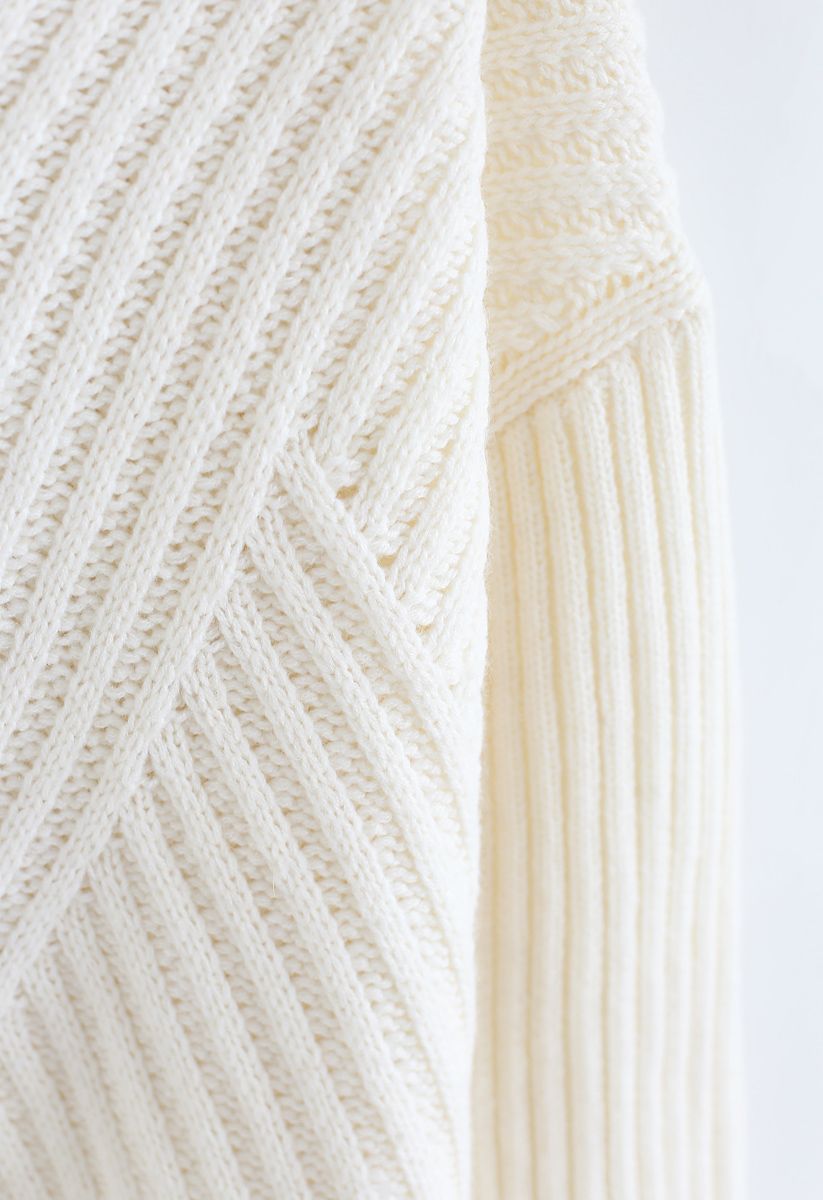 Suéter de punto acanalado con espalda recortada y lazo en marfil