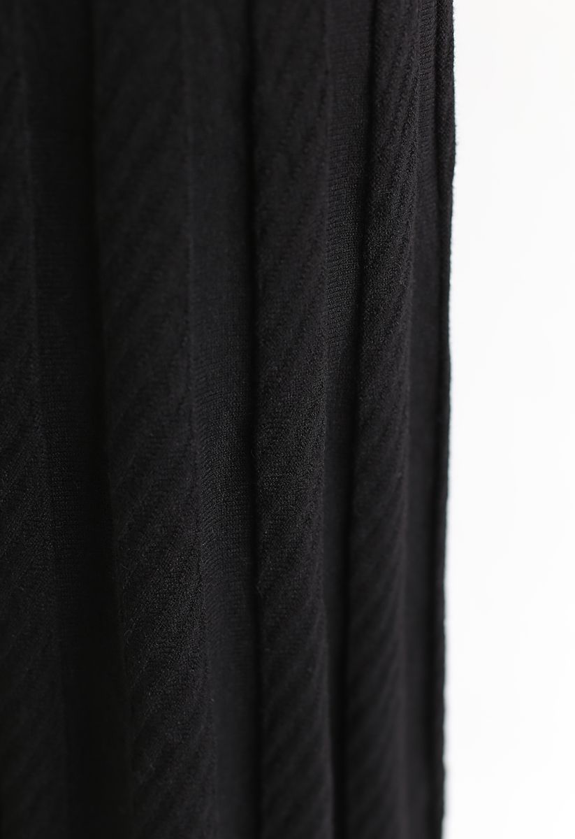 Falda midi de punto con pliegues paralelos en negro