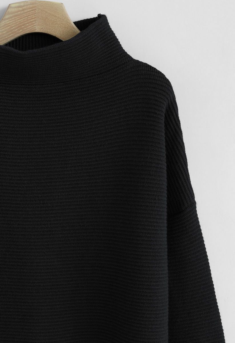Suéter de cuello alto acanalado acogedor en negro