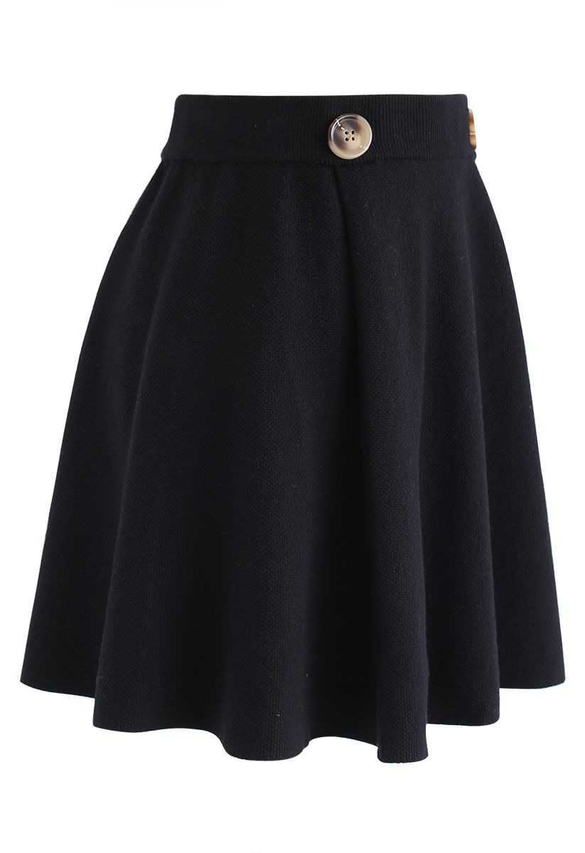Minifalda de punto texturizado con ribete abotonado en negro
