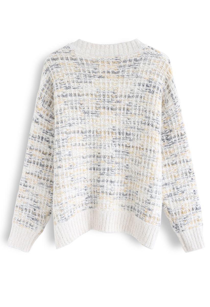 Suéter de punto esponjoso de color con cuello en V en marfil