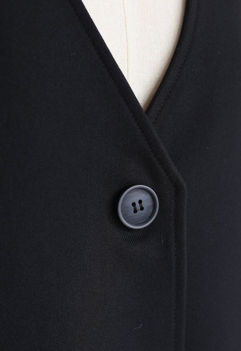 Abrigo largo con cuello en V y bolsillos en negro