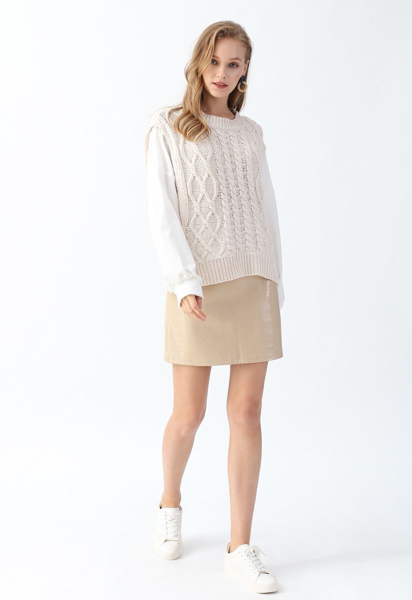 Suéter de punto con mangas empalmadas y textura trenzada en color crema