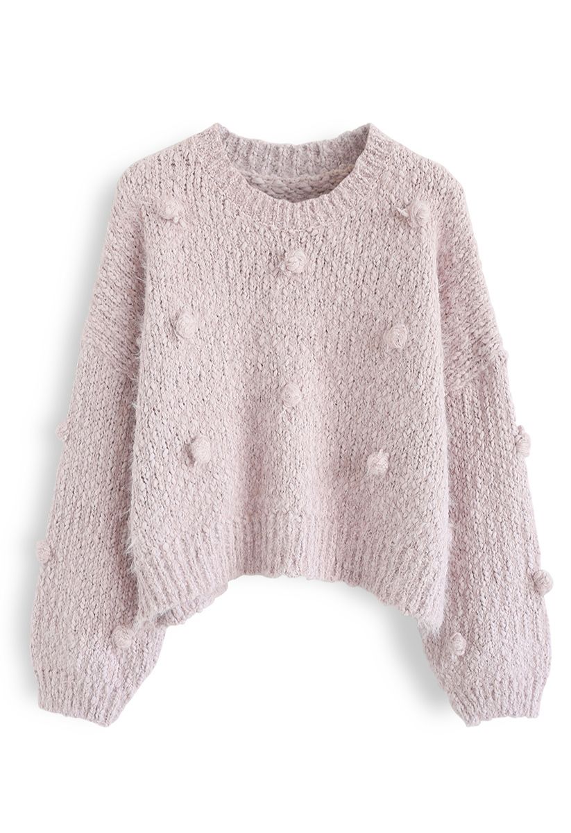 Suéter corto de punto difuso decorado con pompones en rosa