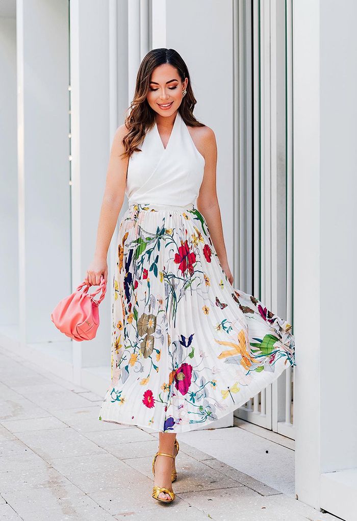 Falda midi plisada con estampado floral tropical