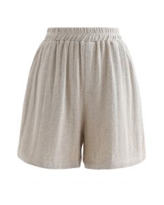 Pantalones cortos de lino y algodón con bolsillos en la cintura elástica en color arena