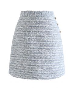 Minifalda de tweed con lentejuelas y ribete de botones en azul