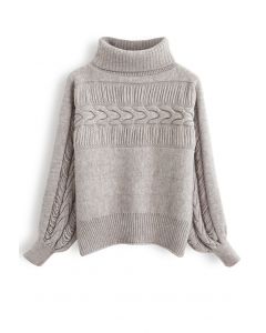 Suéter de lino con cuello alto y detalles con flecos