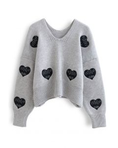 Suéter gris de punto con cuello de pico y parche de Heartbeat
