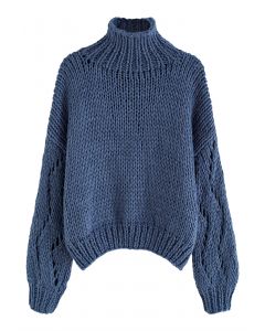Suéter tejido a mano con cuello alto y manga pointelle en azul polvoriento