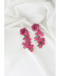 Aretes de flores con cuentas rosadas