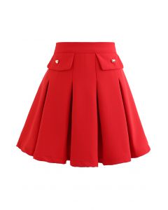 Minifalda plisada con botones de corazón pequeño en rojo