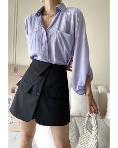 Minifalda pantalón de cintura alta con bolsillo con solapa en negro