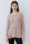 Suéter de punto rasgado con borde cortado sin rematar en rosa
