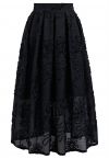 Falda midi plisada de jacquard floral y tallo en negro