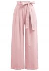 Pantalones anchos plisados con lazo y lazo en rosa