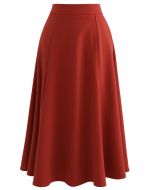 Falda midi con dobladillo acampanado y detalle de costuras en rojo