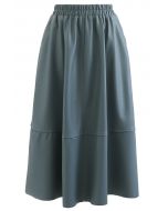 Falda midi de cuero sintético con bolsillo lateral en verde azulado