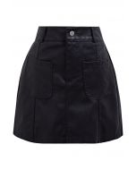 Minifalda de piel sintética con bolsillo de parche en negro