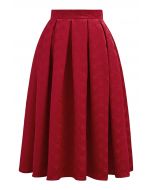 Falda midi plisada de jacquard con corazones opuestos en rojo