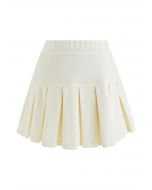 Minifalda acampanada plisada con cintura elástica en color crema