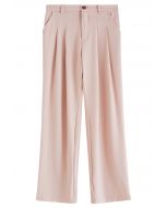 Pantalones de pierna recta con detalles plisados en rosa
