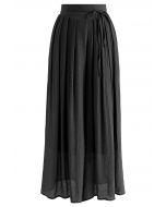 Pantalones anchos plisados con cintura anudada en negro