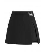 Falda pantalón mini Bud con aberturas decoradas con mariposas de metal en negro