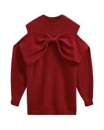 Suéter de punto con hombros descubiertos y lazo en rojo