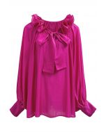 Blusa Dolly con escote con volantes escalonados, mangas farol y lazo en color magenta