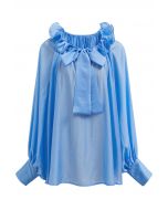 Blusa Dolly con escote con volantes escalonados, mangas farol y lazo en azul