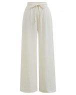 Pantalones ligeros de algodón con cordón en color crema