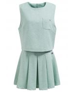 Conjunto elegante de top sin mangas de tweed y minifalda plisada en color menta