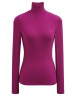 Blusa de manga larga con cuello alto y efecto cruzado en color magenta