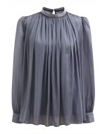 Blusa transparente con escote de cuentas brillantes en gris