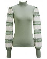 Blusa de punto con cuello alto y mangas farol bordadas en color pistacho