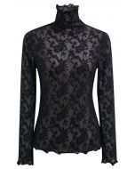 Blusa de manga larga con cuello alto y malla con estampado floral de fantasía en color negro