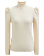 Top de punto con cuello alto y mangas cortas en color crema