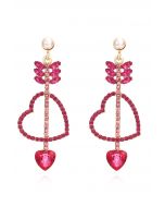 Pendientes colgantes con diamantes de imitación Love Arrows en color magenta