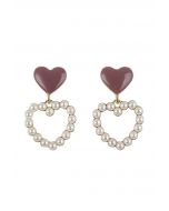 Aretes colgantes de corazones dobles